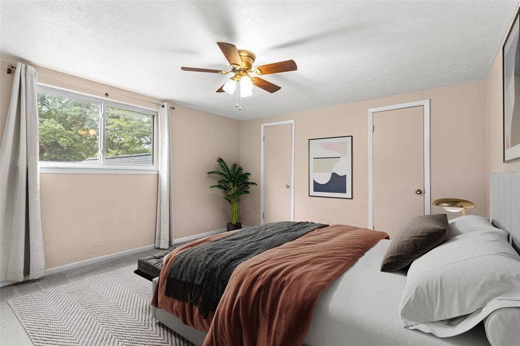 6930 Trailcrest Drive, Dallas, TX 75232 Virtually Staged Interior room featuring a ceiling fan with integrated lighting, wood-finish flooring, and a large window