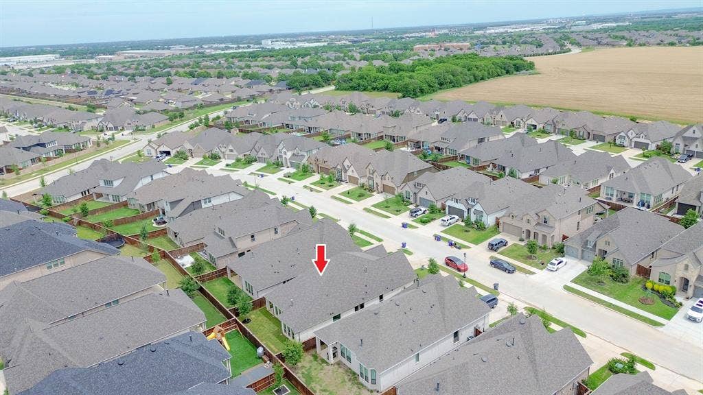 Aerial perspective showcasing a residential development with a consistent architectural style