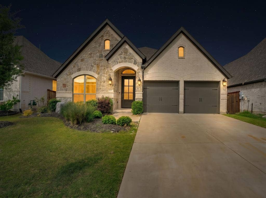 Stone and brick facade with dark trim accents