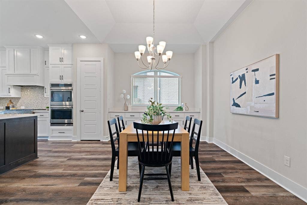 1821 Stonewall Road, Argyle, TX 76226 Open-concept living space with wood-finish flooring and a tray ceiling
