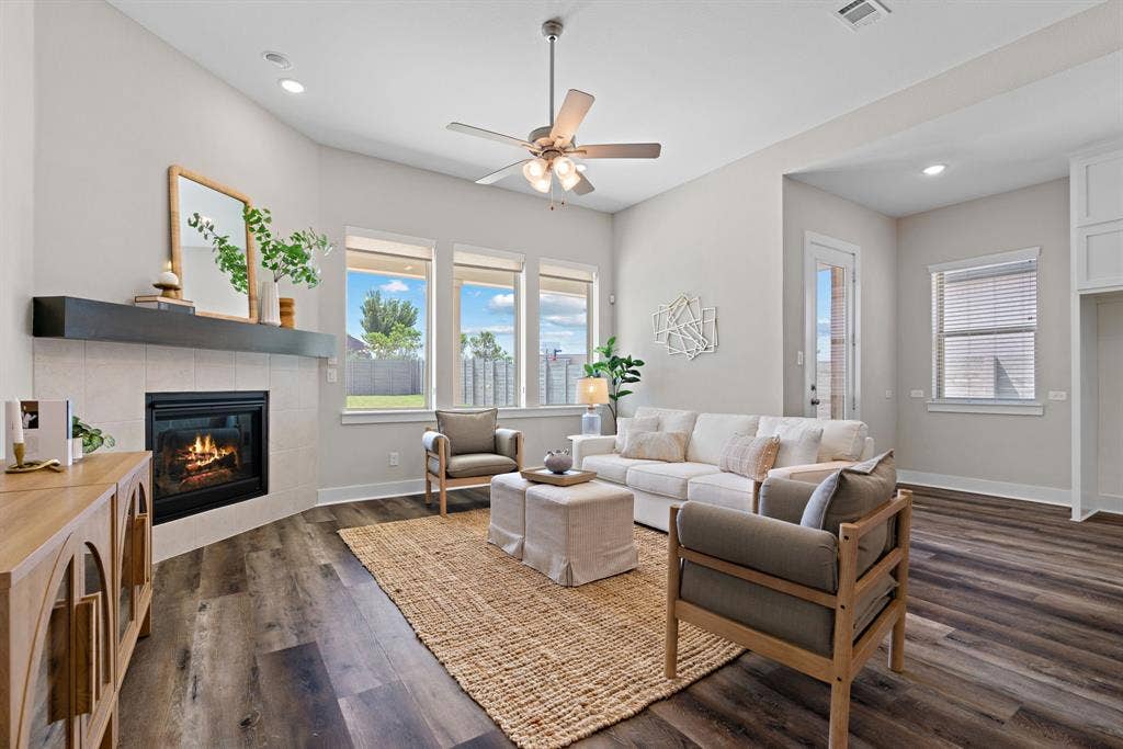 1821 Stonewall Road, Argyle, TX 76226 Living area featuring vaulted ceilings, recessed lighting, and wood-finish flooring