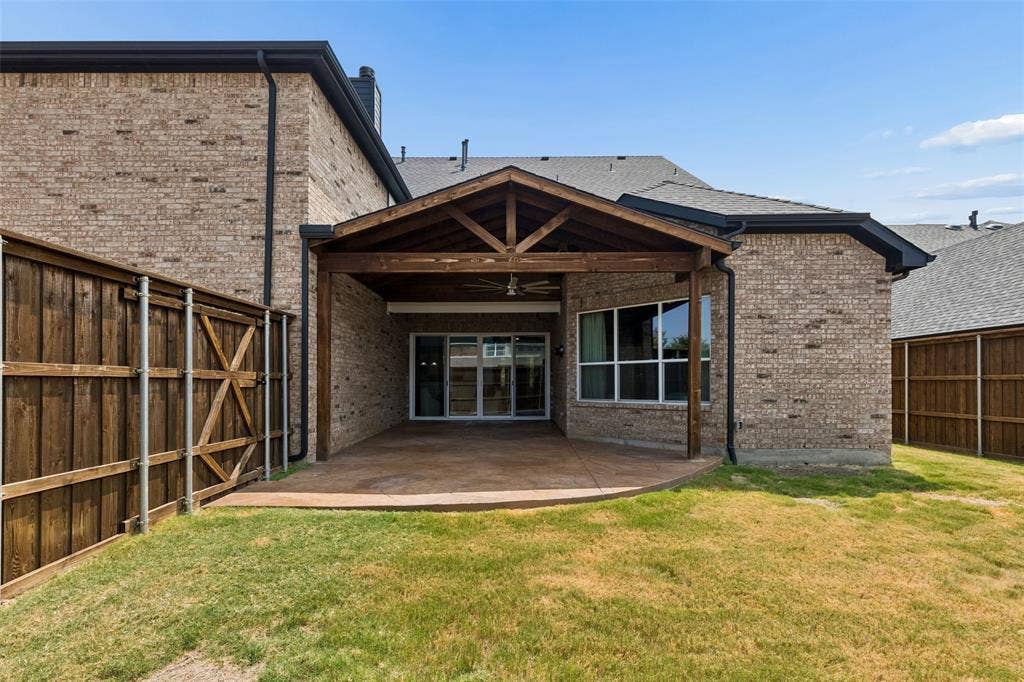 7975 Bishop Drive, Frisco, TX 75036 Back yard extended and covered patio with 8 Ft BOB wood fence.