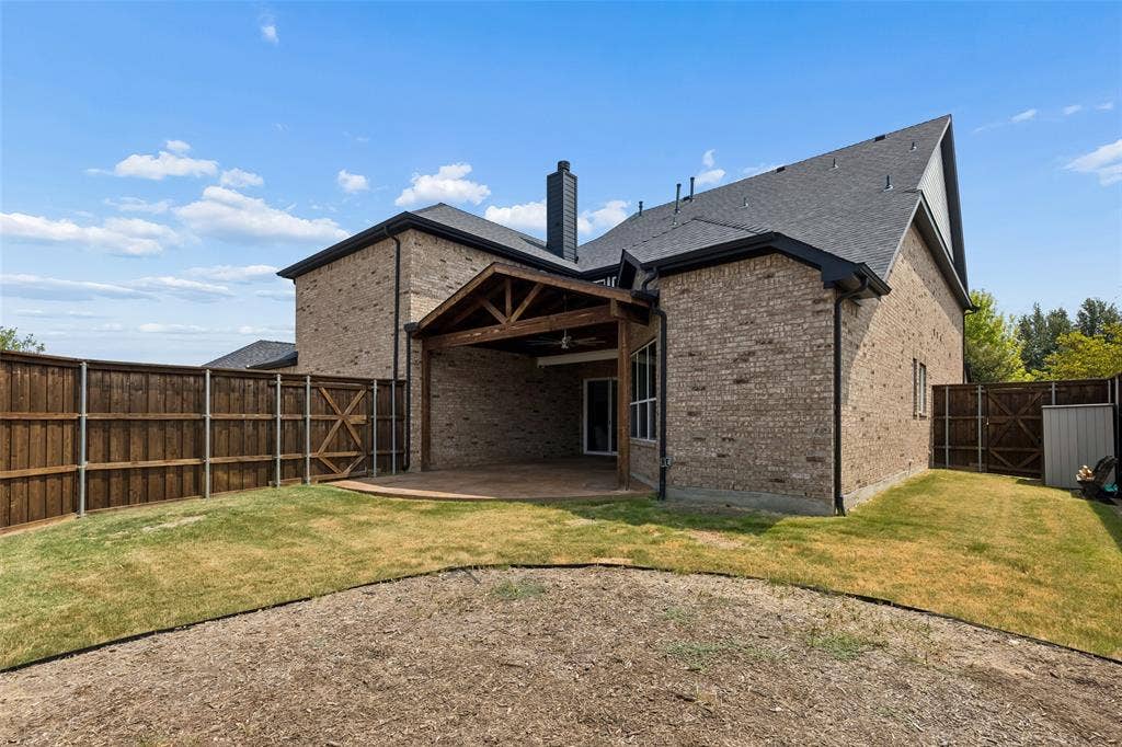 7975 Bishop Drive, Frisco, TX 75036 Back yard extended and covered patio with 8 Ft BOB wood fence.