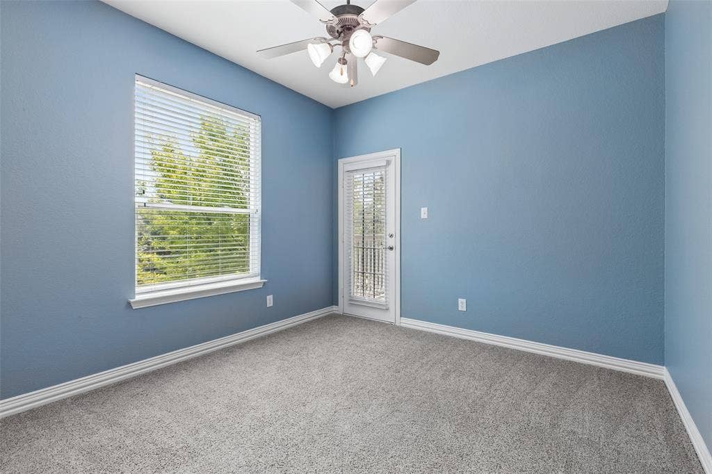 7975 Bishop Drive, Frisco, TX 75036 2nd level guest bedroom with access to exterior patio.