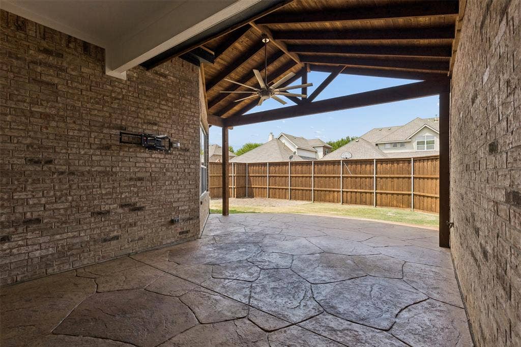 7975 Bishop Drive, Frisco, TX 75036 Back yard extended and covered patio with 8 Ft BOB wood fence.