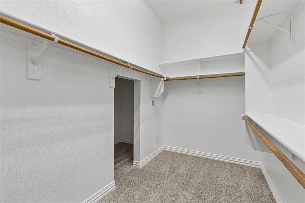 7975 Bishop Drive, Frisco, TX 75036 Main level primary walk in closet with access to extra storage area.