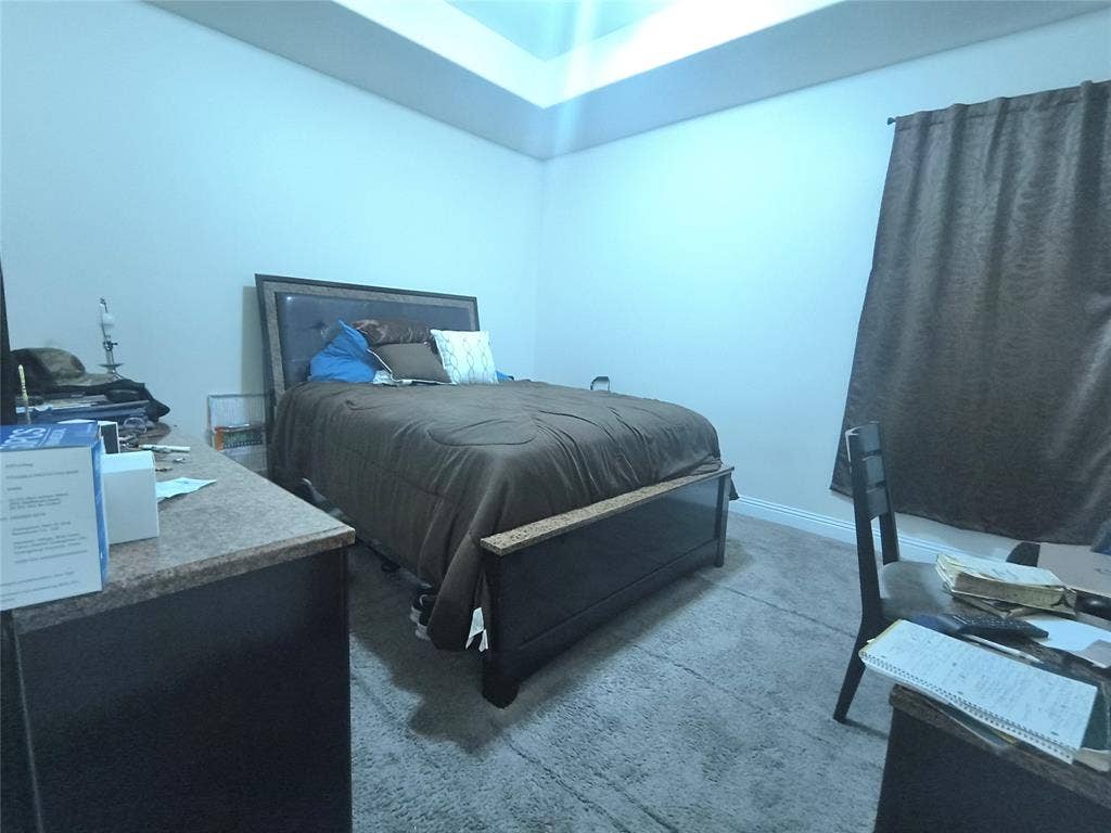 3027 Ames Road, Lancaster, TX 75134 Carpeted room featuring a tray ceiling with recessed lighting