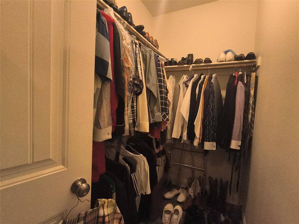 3027 Ames Road, Lancaster, TX 75134 Walk-in closet featuring extensive shelving and multiple clothing rods