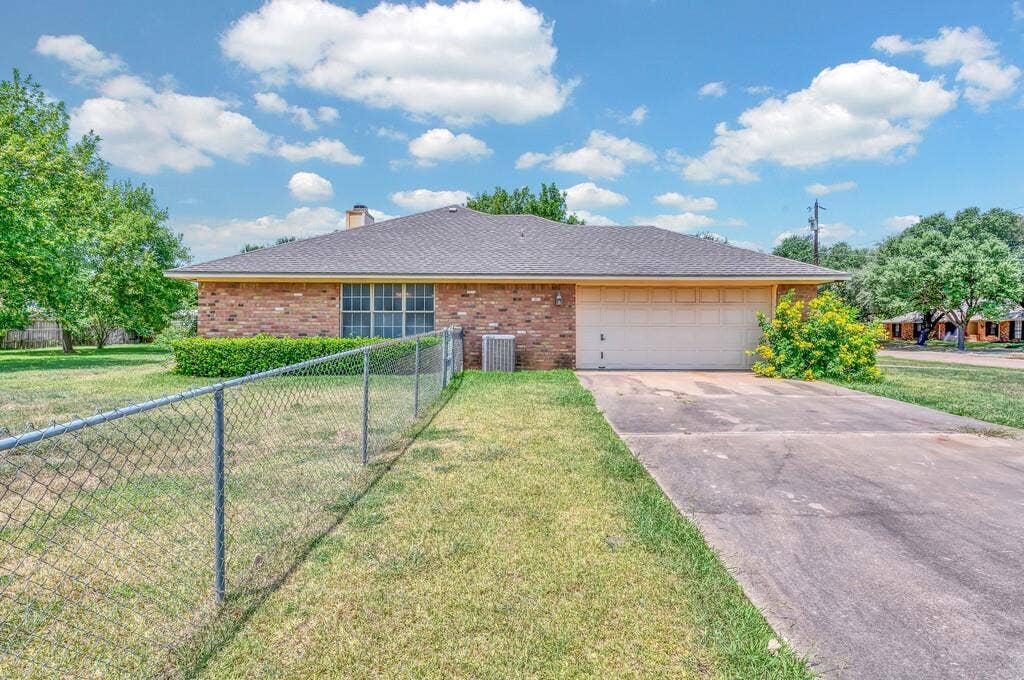 600 Lyndon Drive, Woodway, TX 76712 Brick exterior with an attached two-car garage