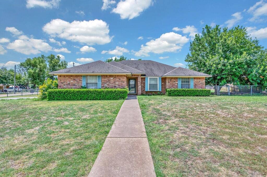 600 Lyndon Drive, Woodway, TX 76712 Brick exterior home with a dark shingle roof