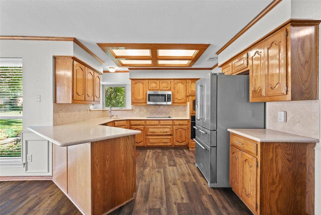 2112 Evergreen Drive, Plano, TX 75075 Bright kitchen with stainless steel KitchenAid refrigerator