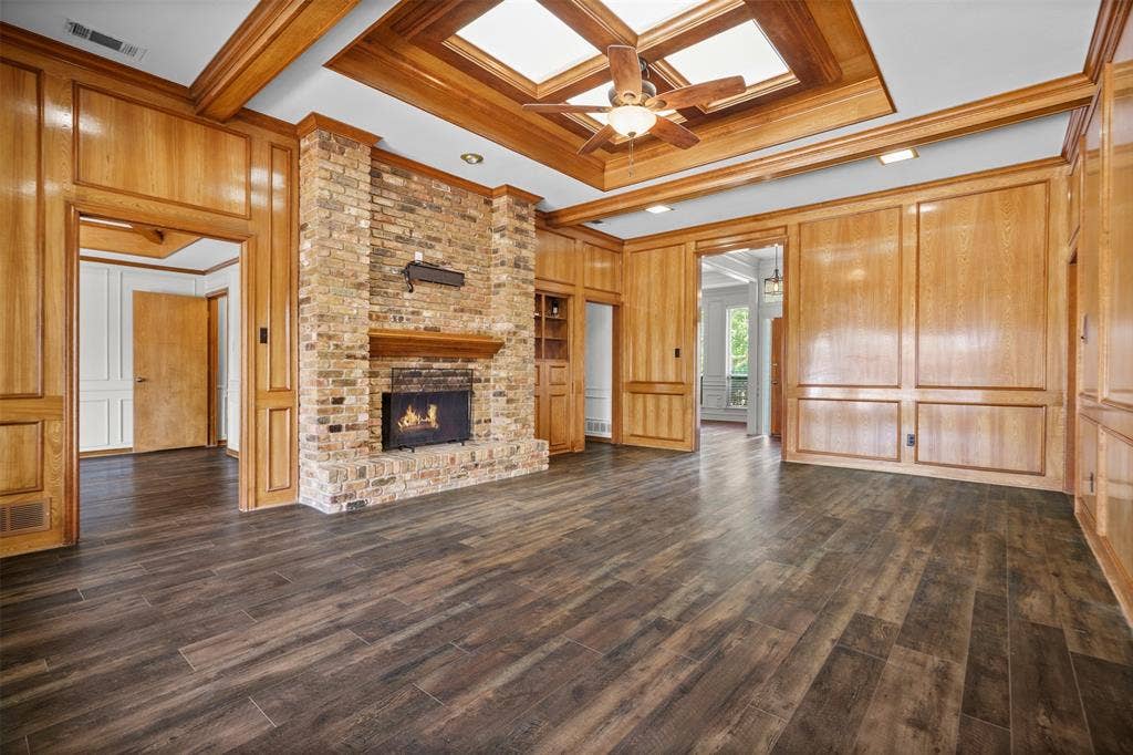 2112 Evergreen Drive, Plano, TX 75075 Oversized living room with built ins and a fireplace looking out to the pool