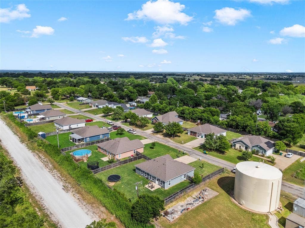 215 Greenbriar Street, Robinson, TX 76706 Aerial perspective showcasing a residential community with single-story homes and mature tree coverage
