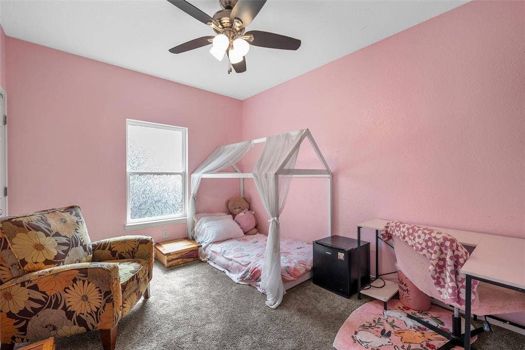 215 Greenbriar Street, Robinson, TX 76706 Bedroom featuring a ceiling fan with integrated lighting, frosted window, and soft carpet flooring