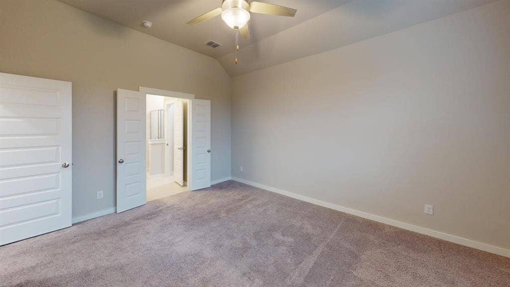 1323 Great Sand Dune Street, Royse City, TX 75189 Carpeted interior space featuring a vaulted ceiling and a ceiling fan with integrated lighting