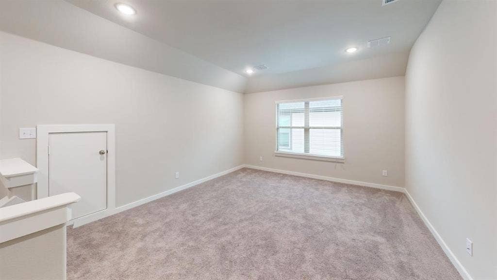 1323 Great Sand Dune Street, Royse City, TX 75189 Carpeted room featuring a single window, white trim, recessed lighting, and a sloped ceiling