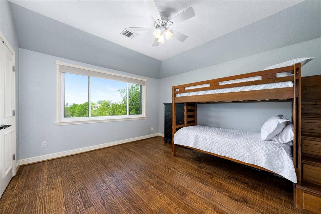 another guest bedroom upstairs with ensuite bathroom and golf course views