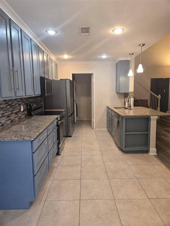 1402 Signet Drive, Euless, TX 76040 Spacious kitchen featuring light blue cabinetry with brushed nickel hardware, granite countertops, and a mosaic tile backsplash