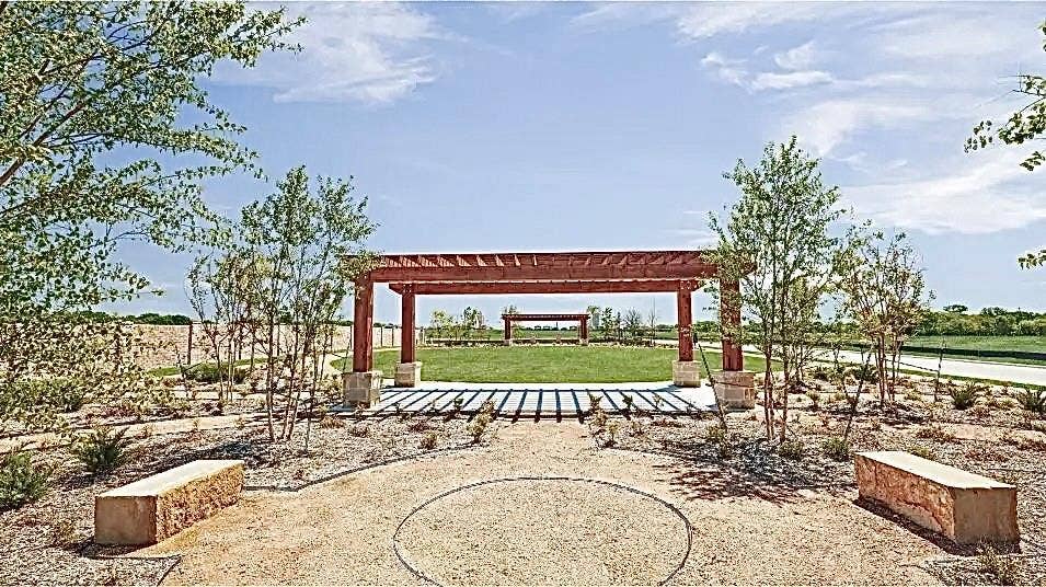 7212 Gray Wolf Lane, McKinney, TX 75071 View of property's community featuring a pergola and a yard