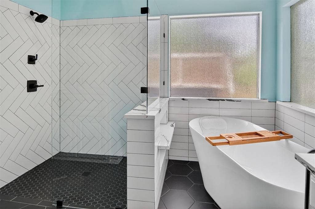 1202 Forest Park Drive, Weatherford, TX 76087 Ensuite bathroom with large free-standing soaking tub and separate walk-in shower.