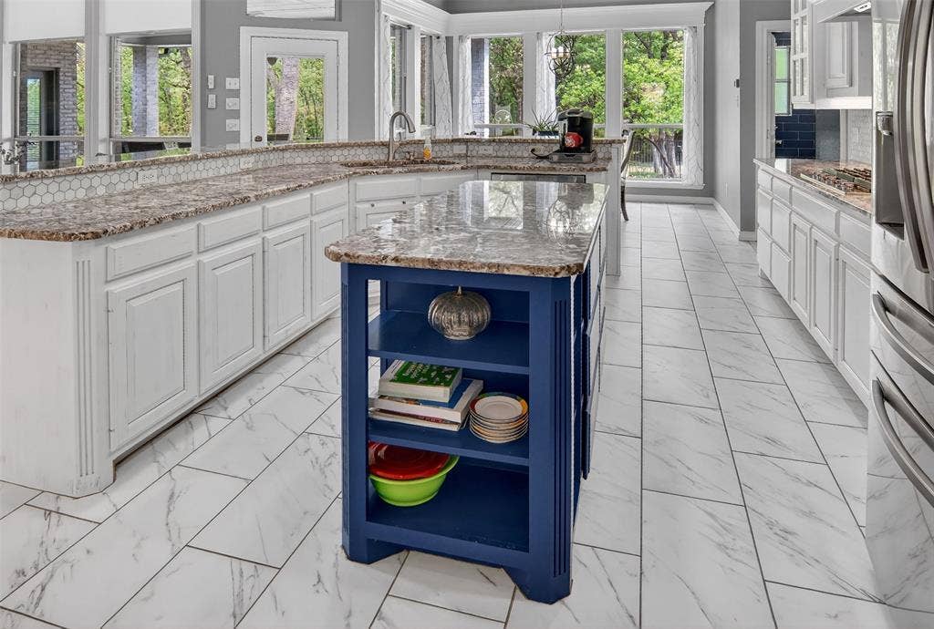 1202 Forest Park Drive, Weatherford, TX 76087 Spacious kitchen with plenty of storage and island for prep work.