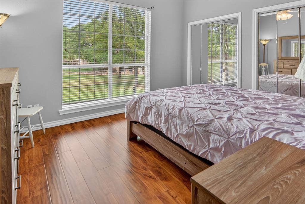 1202 Forest Park Drive, Weatherford, TX 76087 Large window, ceiling fan, and ample closet space in this nice-sized bedroom.