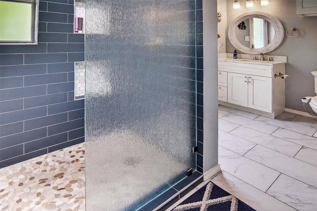 1202 Forest Park Drive, Weatherford, TX 76087 Full bathroom accessible from backyard and pool area.