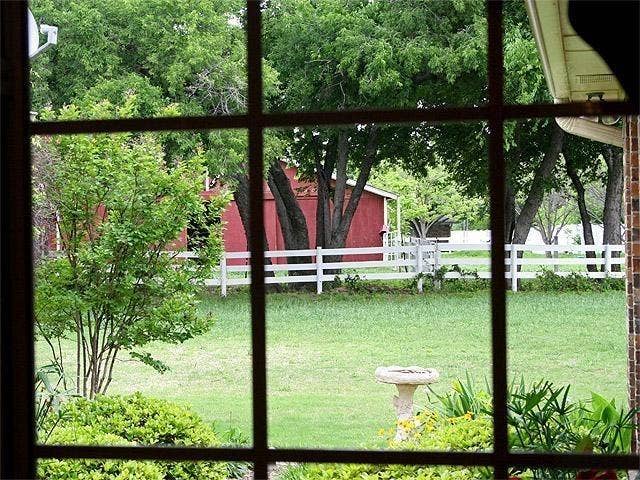 257 Love Bird Lane, Murphy, TX 75094 Clear view of horse barn in neighbor's yard.