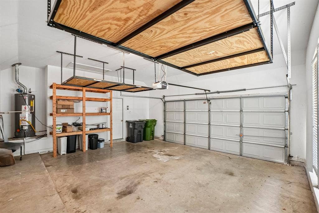 257 Love Bird Lane, Murphy, TX 75094 2 car front garage with extra storage shelves.