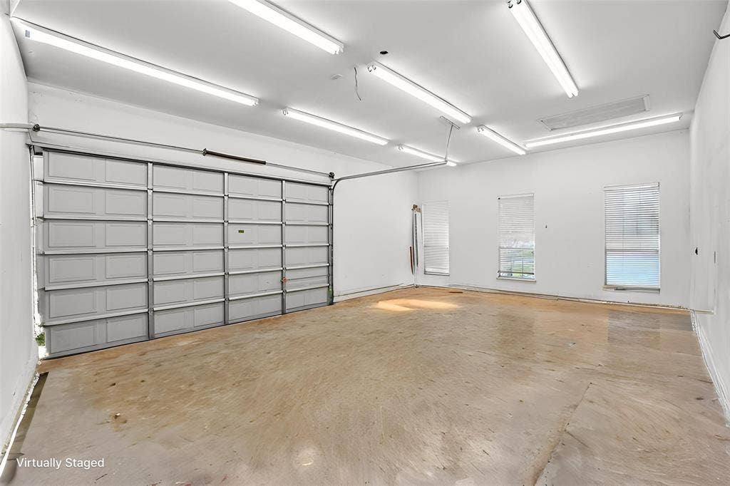 257 Love Bird Lane, Murphy, TX 75094 So many possibilities with this 20' x 28' space with private entrance door with 12' high double garage door and 220 outlet. Great space for hobbies, work area or in law suite.