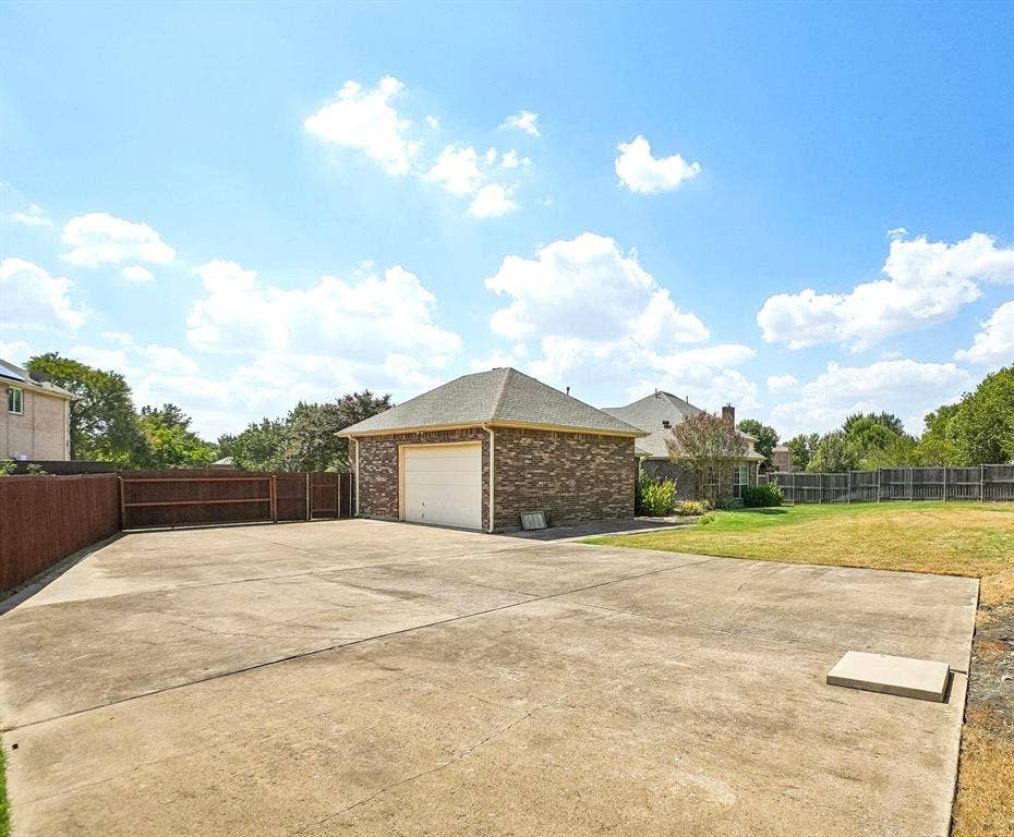 257 Love Bird Lane, Murphy, TX 75094 Extra large parking space behind the privacy gate for all your vehicles with additional space for an inground pool.