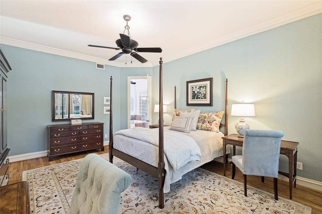 1021 Bandelier Drive, Allen, TX 75013 Primary bedroom offers hardwood floors, plantation shutters and lovely crown molding detail and en-suite bath