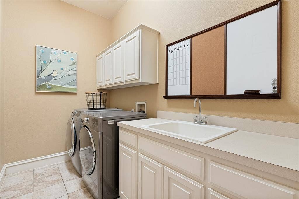1021 Bandelier Drive, Allen, TX 75013 Large Utility Room with Full size washer-dryer area, sink, folding area and cabinets AND Utility Sink