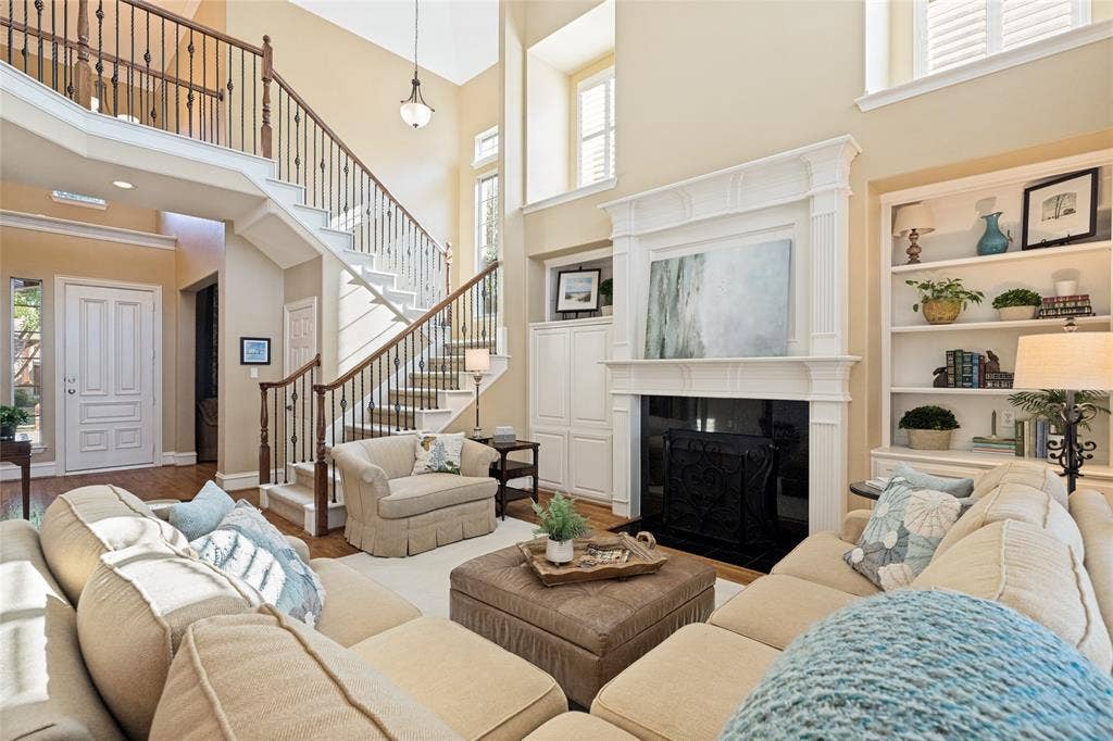 1021 Bandelier Drive, Allen, TX 75013 Spacious living area downstairs with gas fireplace, double stacked mantel, built-in bookcases and cabinetry