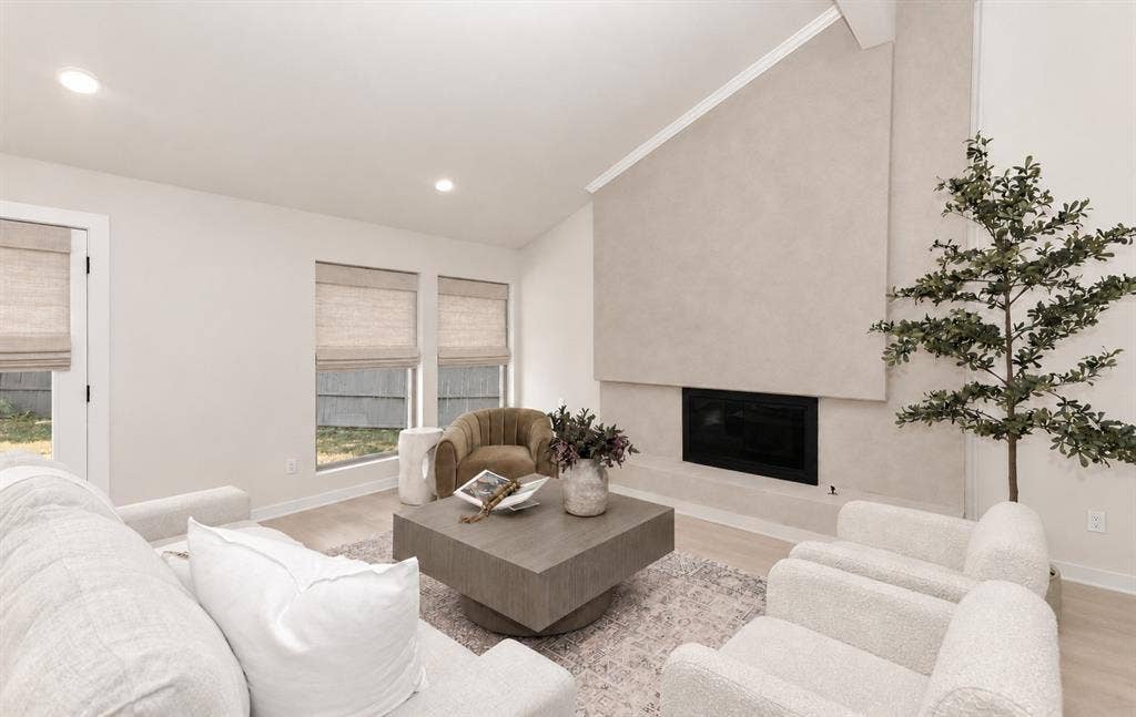 Vaulted ceiling with an integrated fireplace makes for entertaining and cozy conversation