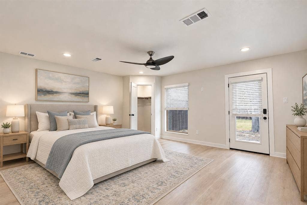 Bedroom 4 is oversized at 18x16. Recessed lighting, wood-finish flooring, ceiling fan, and a glass-paneled door to the backyard.