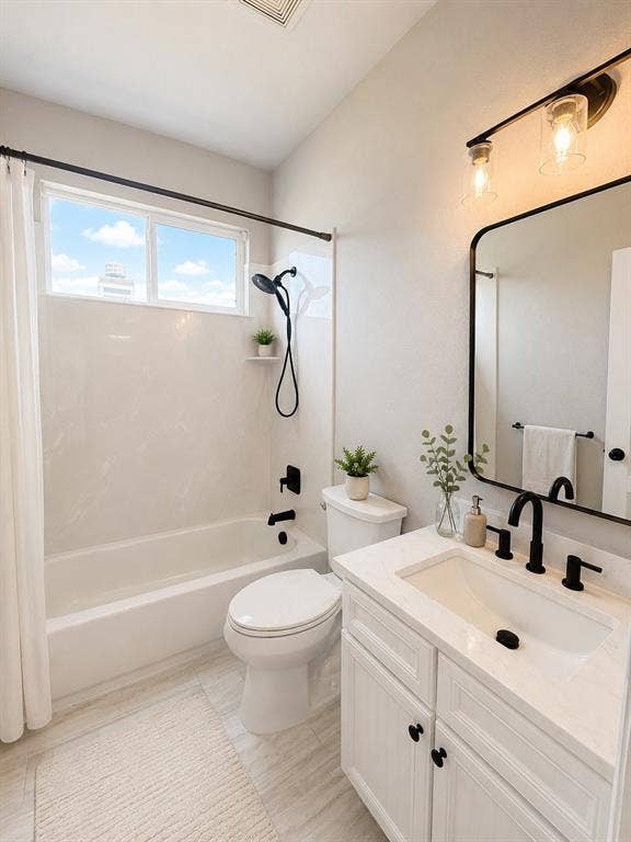1709 Belton Drive, Prosper, TX 75078 Modern bathroom featuring a white vanity with integrated sink, matte black fixtures, and a framed mirror