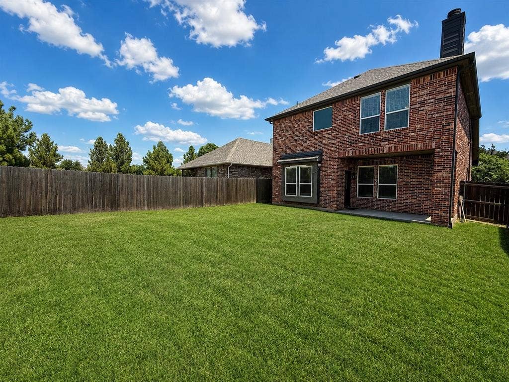 1709 Belton Drive, Prosper, TX 75078 Expansive green lawn with a full privacy fence