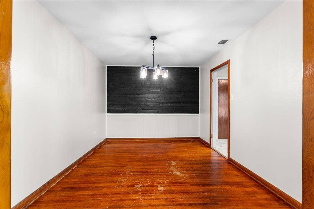 3325 Windsor Avenue, Waco, TX 76708 Dining Area with original hardwood floors & accent wall