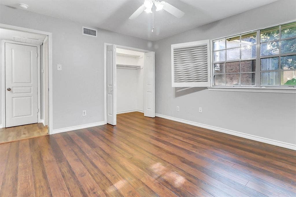 5881 Preston View Boulevard, Dallas, TX 75240 Large bedroom with ceiling fan