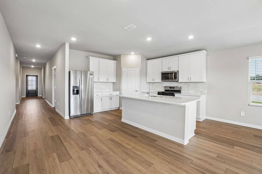 6110 Chickney Drive, Princeton, TX 75071 Photo is not of the actual home, but is an inspirational photo of builder’s model home and may depict options, furnishings, and/or decorator features that are not included.