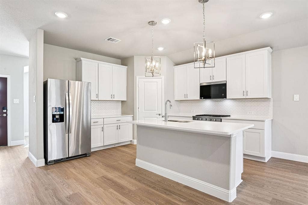 6108 Chickney Drive, Princeton, TX 75071 Photo is not of the actual home, but is an inspirational photo of builder’s model home and may depict options, furnishings, and/or decorator features that are not included.