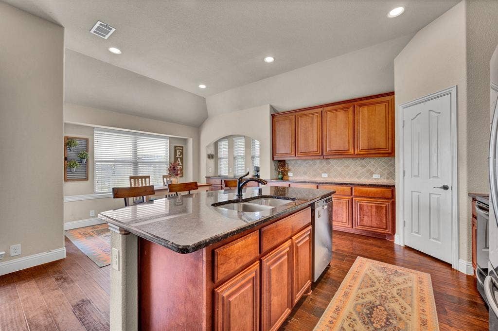 Open concept kitchen with plenty of counter space, cabinets, and large walk-in cabinet