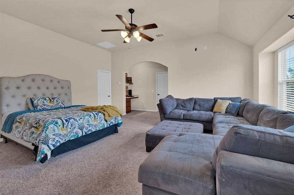 Versatile upstairs space with a bathroom, built-in desk area, and attic access