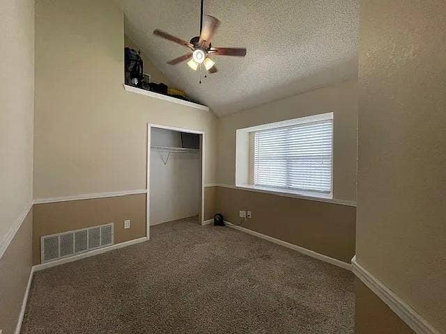 2062 Bronco Lane, Keller, TX 76248 Carpeted room featuring a vaulted ceiling and an integrated ceiling fan
