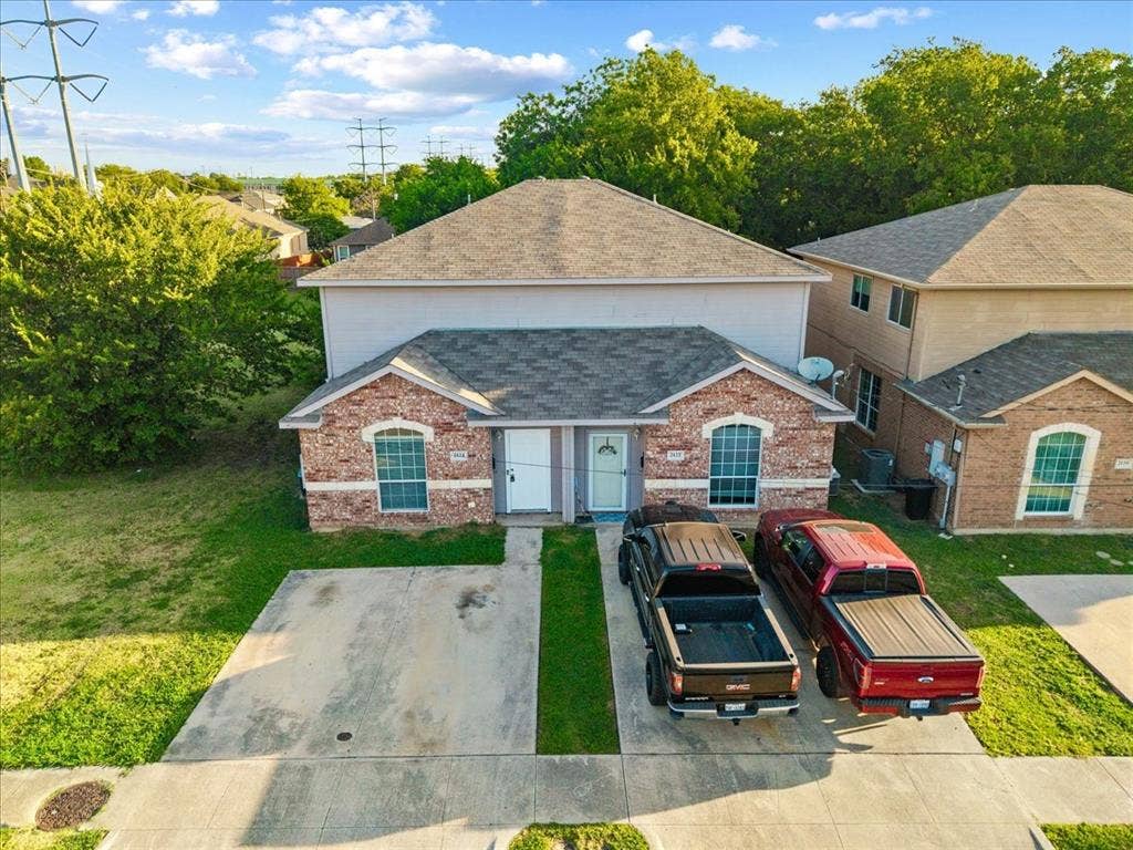 2122 W E Roberts Drive, Grand Prairie, TX 75051 Duplex property featuring brick and siding exterior construction
