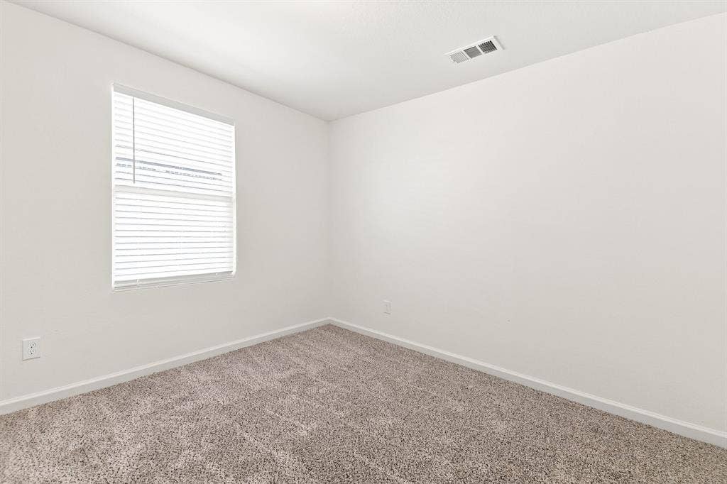 6520 Calico Lane, Forney, TX 75126 Neutral-toned wall-to-wall carpeting and crisp white walls