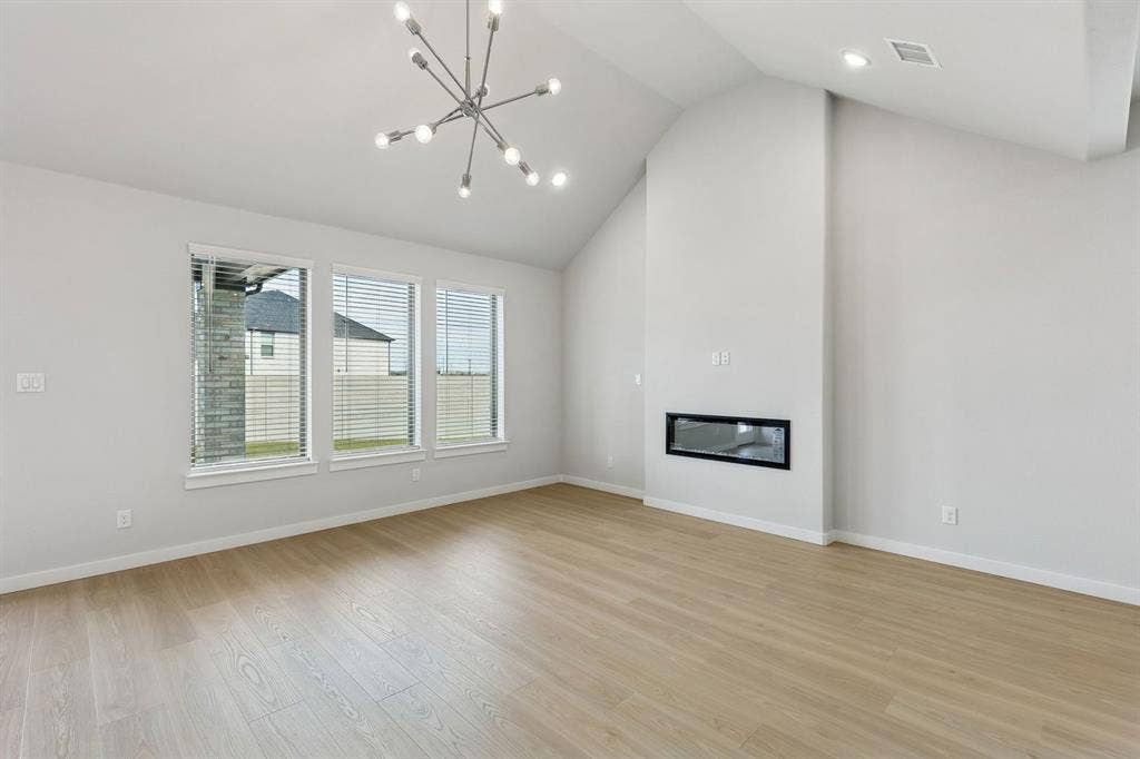 4704 Starlight Drive, McKinney, TX 75071 Living Room in the Stanley II home plan by Trophy Signature Homes – REPRESENTATIVE PHOTO