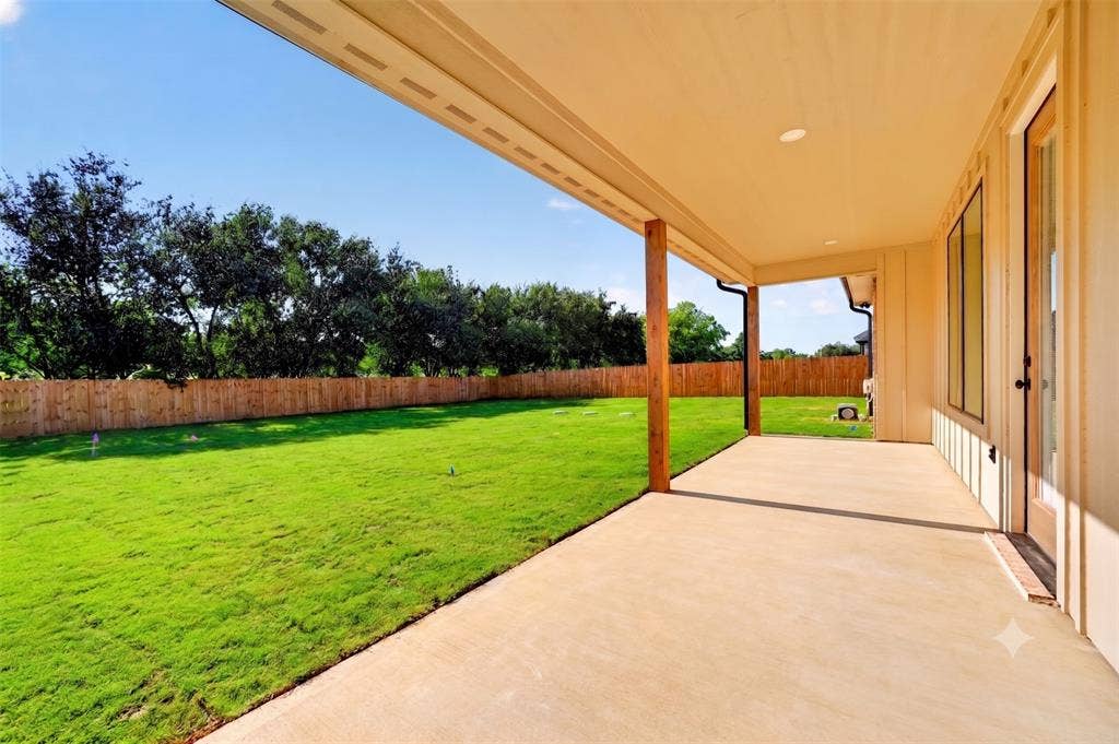 Covered back patio offers a place to relax & unwind while watching the pets play or even space to spread out & enjoy annual gatherings.