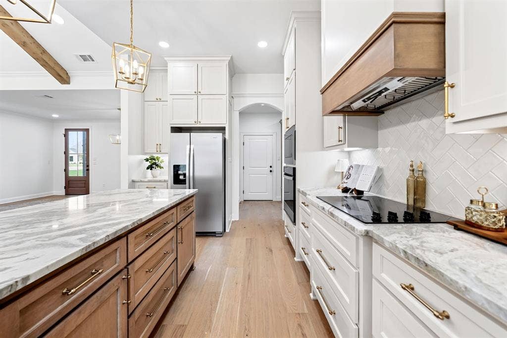 Kitchen with view of mudroom area with garage access.